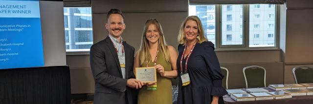 Margo Janssens (in the middle) receives award in Boston