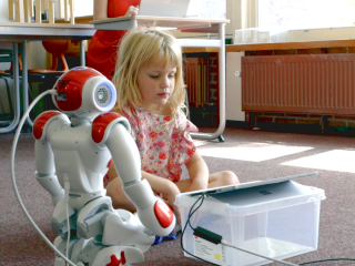 Child engaging with robot